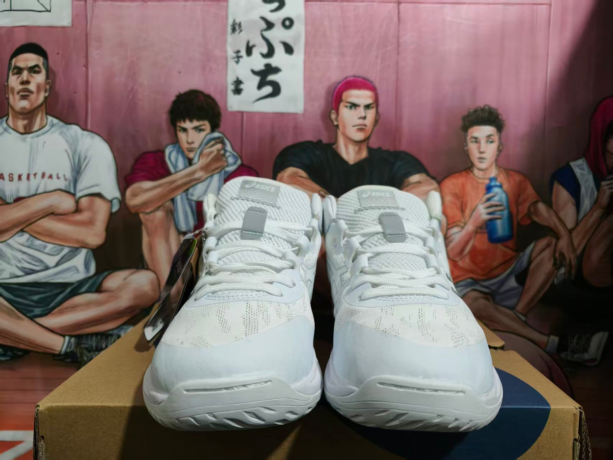 Front view of white and gray ASICS basketball shoes