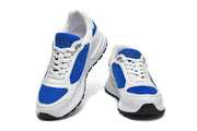 Front view of white and blue lace-up sneakers.