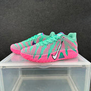 Angled front-side view of the blue and pink Nike basketball sneaker pair.