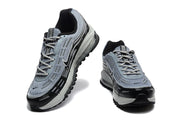 Front and angled views of grey and black Nike Air Max 97 OG sneakers