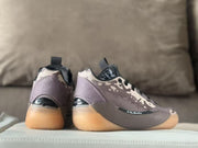 Rear and side views of the Air Jordan 39 sneakers, including heel details and patterned panels.