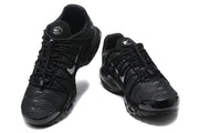 Front view of a pair of black lace-up mesh-patterned sneakers