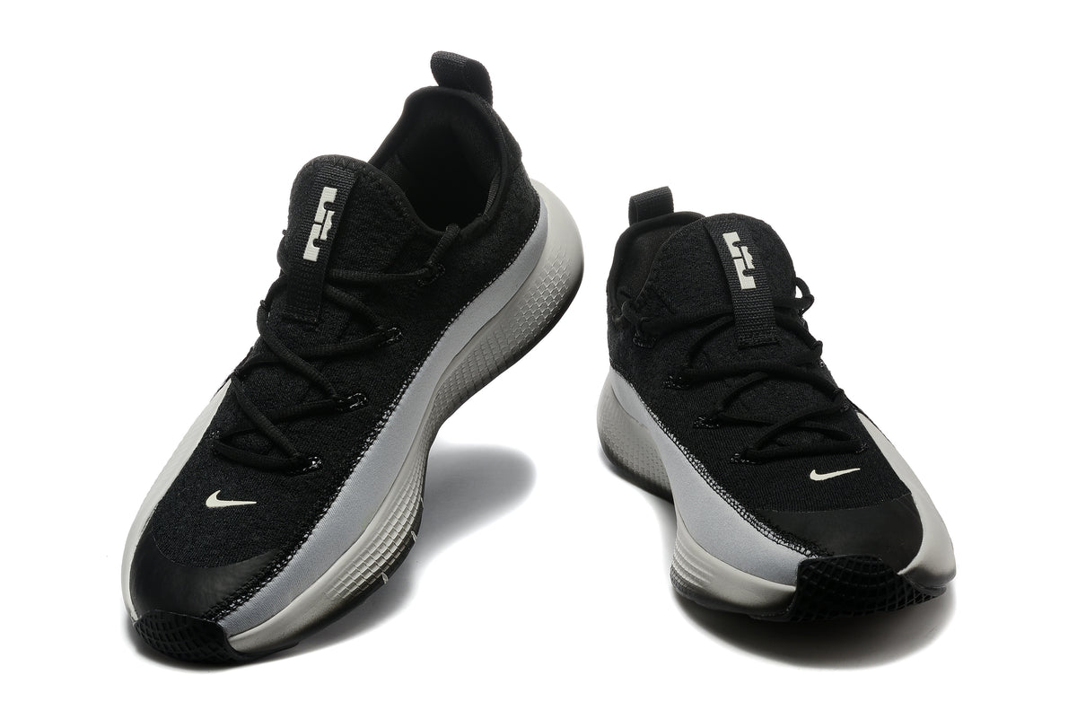 Black and light gray Nike LeBron TR1 low-top basketball shoes, front view