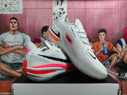 Angled view of paired white Nike basketball shoes showing textured uppers, GT heel branding, and colorful outsole details.