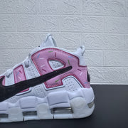 Close-up of pink heel lettering, colorful sprinkle details, and black Swoosh.