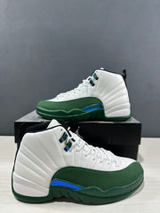 Close three-quarter view highlighting the white stitched upper, green overlays, and blue-toned side detail.