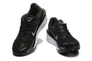 Black Nike Zoom Fly 6 shoes with light-colored swooshes, viewed from the front