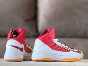 Rear and side view highlighting the high-top collar, white heel panel, and burgundy Swoosh.