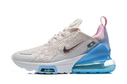 Side view of a Nike Air Max 270 Premium sneaker with a cream-white upper, pink accents, and blue heel