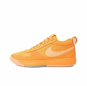 Orange low-top sneaker with a light contrasting side swoosh and orange outsole.