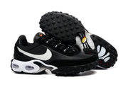 Black Nike sneakers shown from the side and outsole, highlighting the white Swoosh and tread pattern.