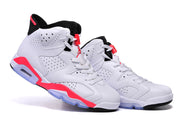 Angled product view of the white and red high-top sneakers with visible lace locks and translucent cushioning windows.