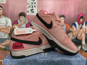 Angled view of the pair showing the black Swoosh, textured uppers, contrasting heel graphics, and speckled midsoles.