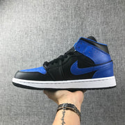 Opposite side profile showing the black and blue high-top sneaker and blue side branding.