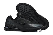 Black Nike Air Max sneakers showing the side and treaded outsole.