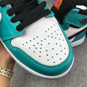 Close-up of the perforated white toe box and black laces.