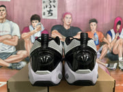 Rear view showing the black heel panels, pull tabs, and white outsole sections.