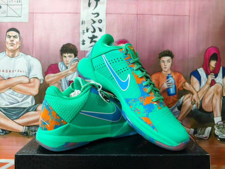 Nike basketball shoes in turquoise with blue and orange graphic accents, shown from the side.