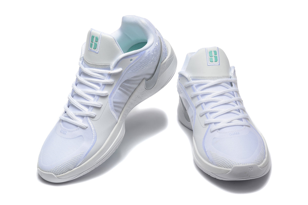 Pair of white Nike Sabrina 2 basketball shoes shown from the front and side, with mint tongue accents.