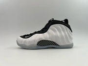 Black and white high-top sneaker with a checkerboard side insert.