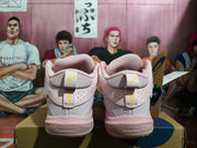 Rear view showing the padded heels and wraparound straps of the pink ASICS shoes