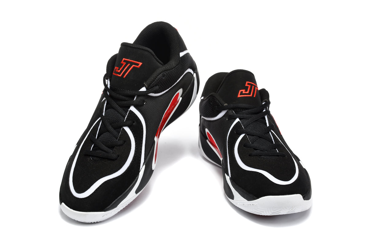 Pair of black basketball sneakers with white curved detailing, red accents, black laces, and red tongue branding.