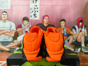 Rear view of orange basketball shoes showing padded heel collars and sculpted soles.