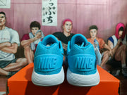 Rear view showing the blue heel panels and white ridged outsoles