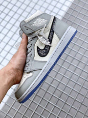 Side view showing the ankle wing detail, patterned Swoosh, decorative charm, and blue outsole.