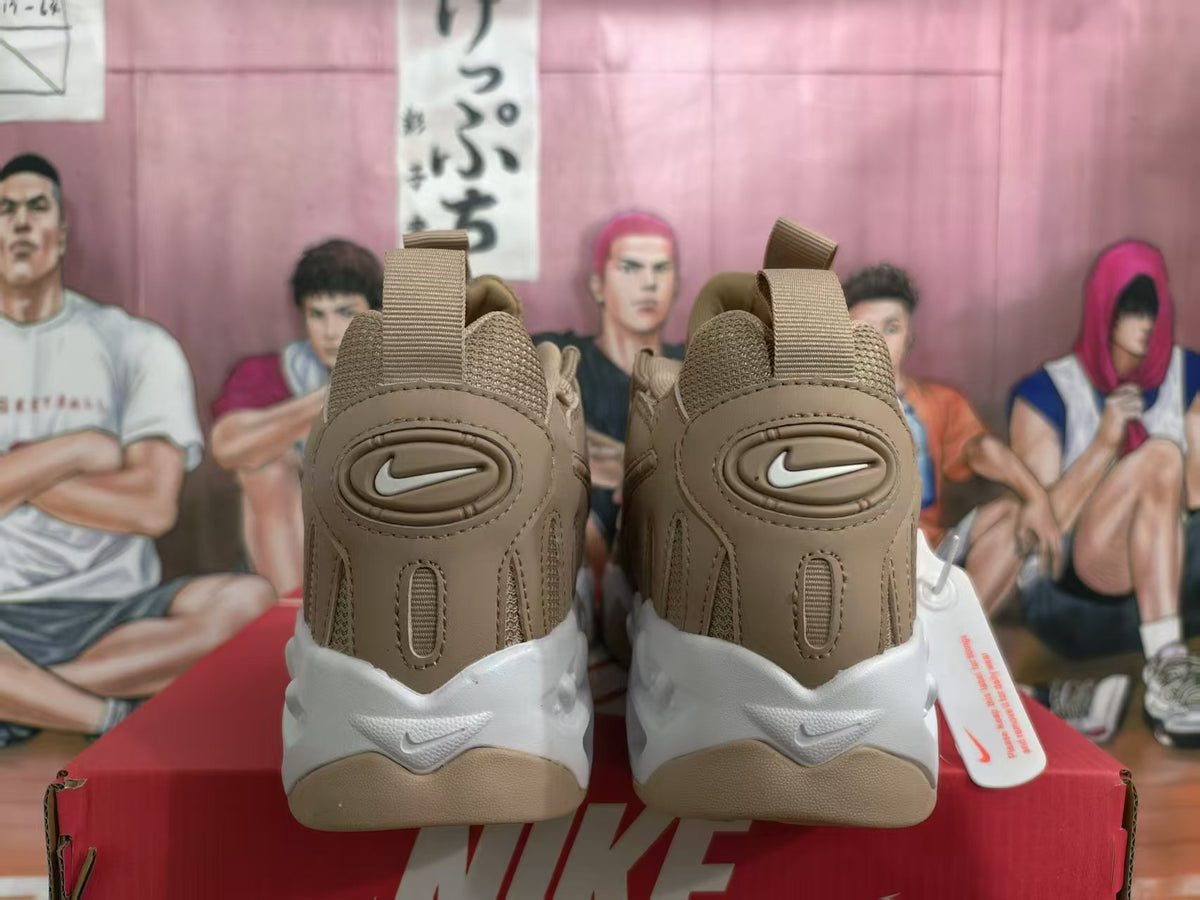 Rear view of brown Nike sneakers with white soles and heel branding.