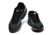Front view of a pair of black sneakers with turquoise patterned accents