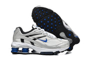 Nike Shox Ride 2 sneakers shown from the side and outsole, highlighting blue outsole details.
