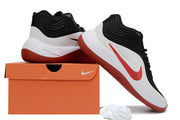 Black, white, and red Nike basketball sneakers shown with an orange shoe box and spare white laces.