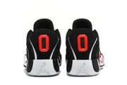 Rear view of the black sneakers showing red heel details, white midsoles, and embossed Jordan logos.