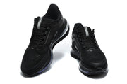 Pair of black Nike running shoes viewed from the front.