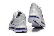 Rear views of light grey Nike Pegasus Premium shoes with layered soles