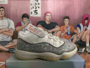 Side view showing the white upper, gray patterned side panel, white laces, and visible AJ-1 tag.