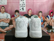 Rear view of a pair of white Nike sneakers showing the lion heel graphics and visible ReactX lettering.