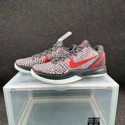 Three-quarter view of the mismatched Nike pair, with red and blue accent versions displayed together.
