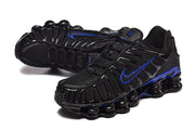 Pair of black and blue Nike Shox TL sneakers shown at an angled view.