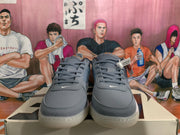 Front view of smoke gray Nike sneakers with gray laces, perforated toe panels and tonal swoosh details.
