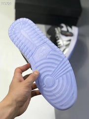 Outsole view showing the translucent blue-tinted rubber sole and circular traction pattern.