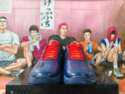 Front view showing perforated toe panels and orange-red laces
