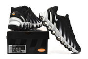Nike Air Max DN sneakers shown beside a box; the visible box label reads US 8.5, US 10, UK 7.5, UK 9, EU 42, and EU 44.