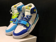 Close front three-quarter view showing contrasting laces, perforated toe panels, and midfoot straps.