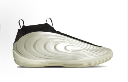 Side view of black sneakers with a light gold-green sculpted sole and tongue and heel pull tabs.