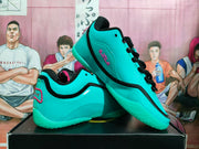 Side view of sky-blue Nike basketball shoes with black laces and trim, pink accents, and turquoise soles