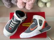 Top view showing the padded collars, laces, perforated panels, and gray toe sections.