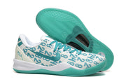 White and teal Kobe 8 Protro shoe with patterned outsole shown.