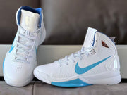 Pair of white and Carolina blue high-top sneakers shown from the front and side.
